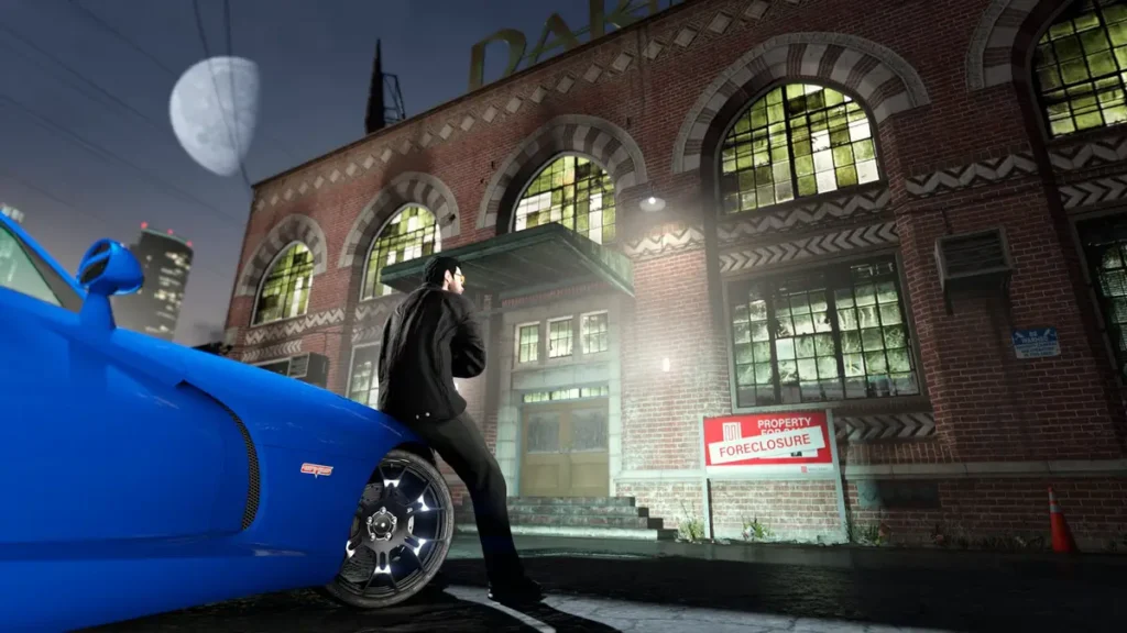GTA 6 vẫn đi đúng lộ trình 1 A GTA Online character leans on a car looking up at the Darnell Bros Garment Factory