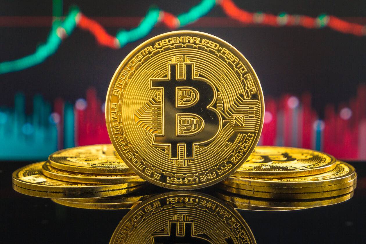 Bitcoin cryptocurrency gold coin. Trading on the cryptocurrency exchange. Trends in bitcoin exchange rates. Rise and fall charts of bitcoin.